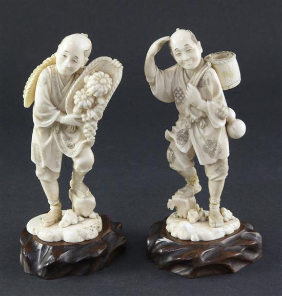 Two Japanese ivory figures of farmers, early 20th century, 15.5cm, damage